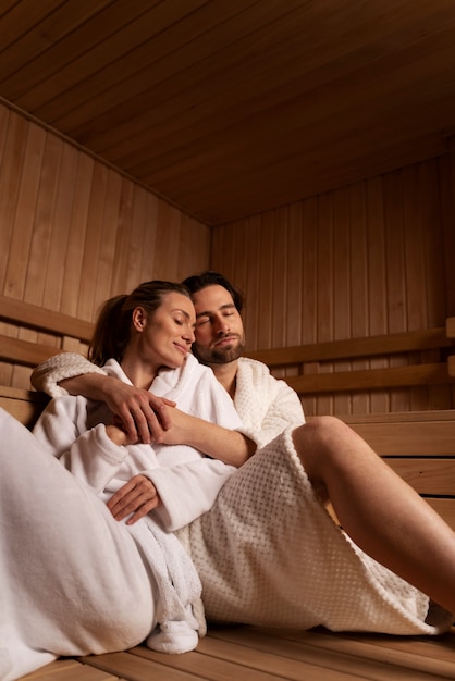 Close up on couple relaxing in the sauna