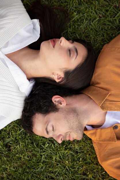 Close up couple sleeping on grass