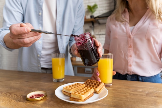 Free Photo close up couple with waffles and jelly