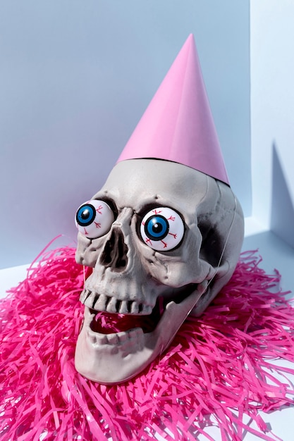 Free Photo close-up creepy halloween skeleton with confetti