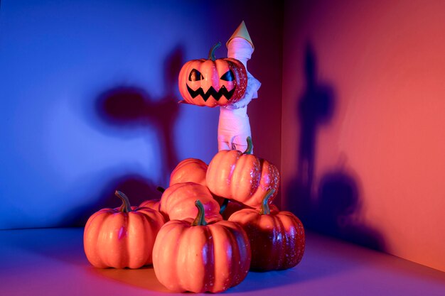 Close-up creepy halloween toys with pumpkins