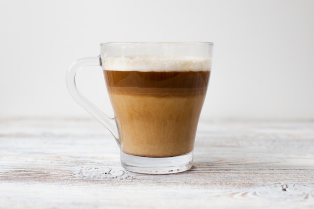 Close-up of cup of coffee in three colors