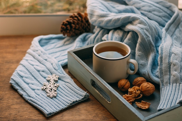 Close-up cup of tea with nuts