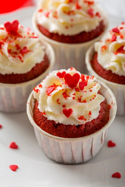 Close-up of cupcakes with heart-shaped sprinkles