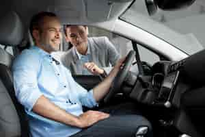 Free photo close up on customer with business person in car dealership