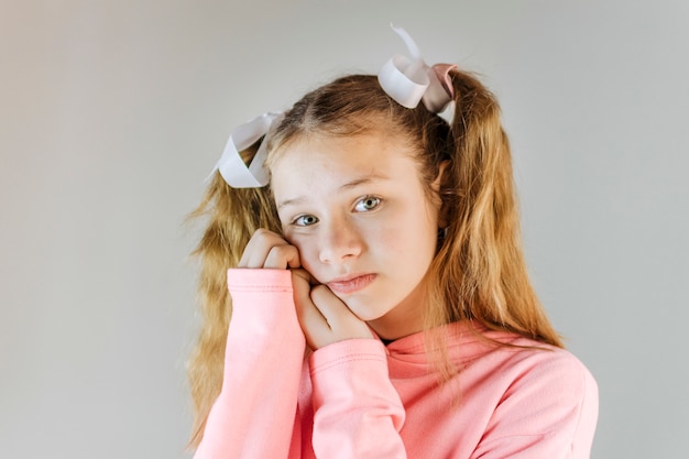 Close-up of a cute girl looking at camera