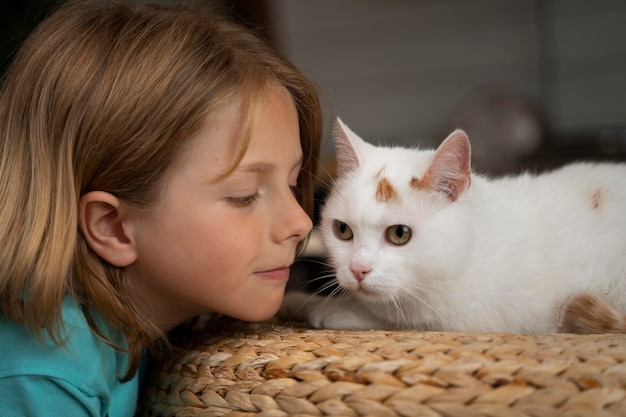 Close up cute kid and cat