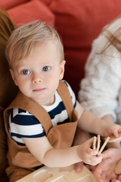 Free photo close up cute toddler with toy