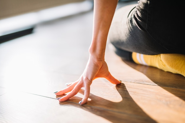 Close up of dancer's hand on the floor