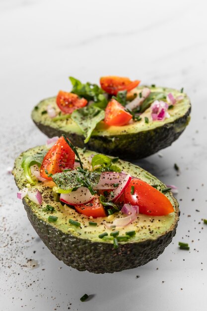 Close-up of delicious healthy salad in avocado composition