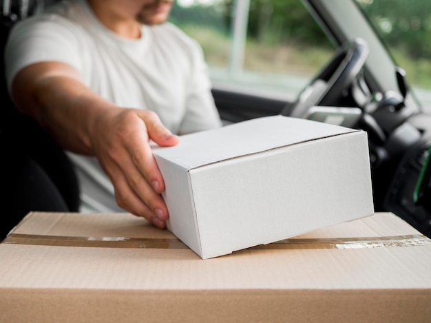 Close-up delivery guy in car