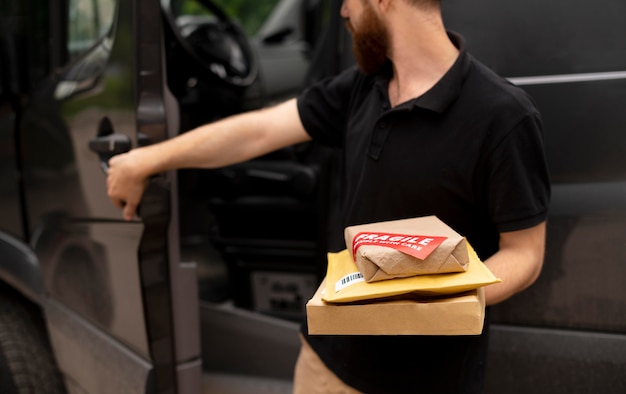 Close up delivery man carrying packs