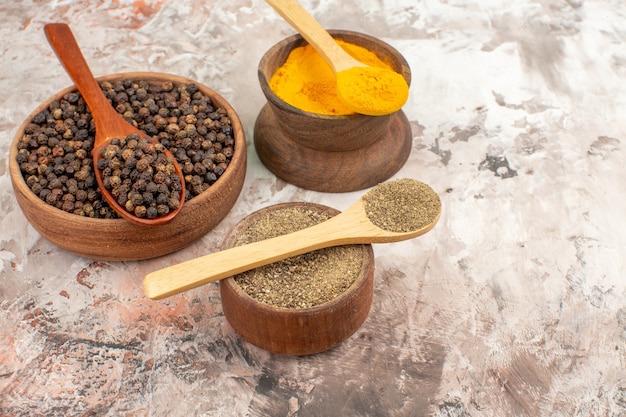 Close up of different spices lined in bowls