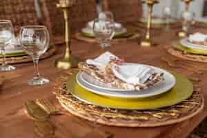 Free photo close-up dining table with plates