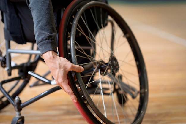 Free Photo close-up disabled man in basketball court