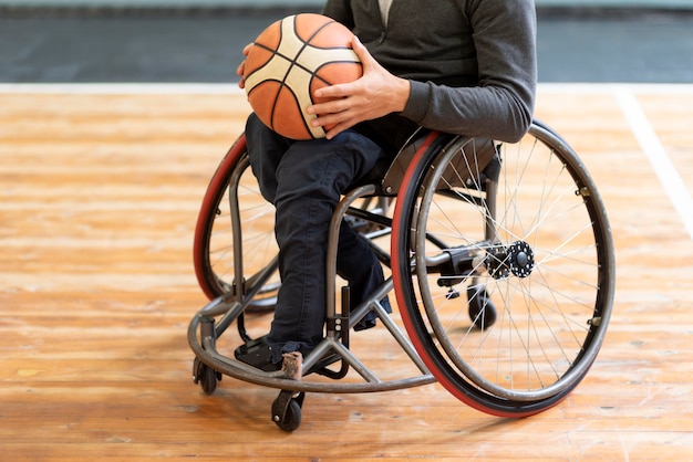 Close-up disabled man holding basketball