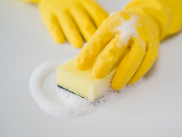 Free Photo close-up disinfecting house with sponge