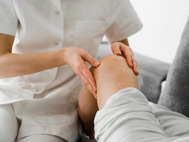 Free Photo close-up doctor checking patient