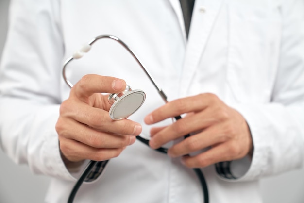 Close up of doctor holding strethoscope