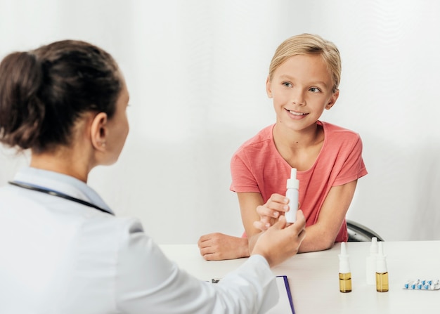 Close-up doctor talking to girl