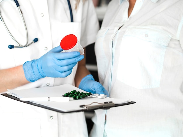 Free Photo close-up doctor wearing gloves