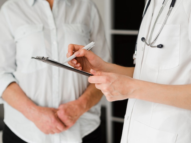 Close-up doctor writing