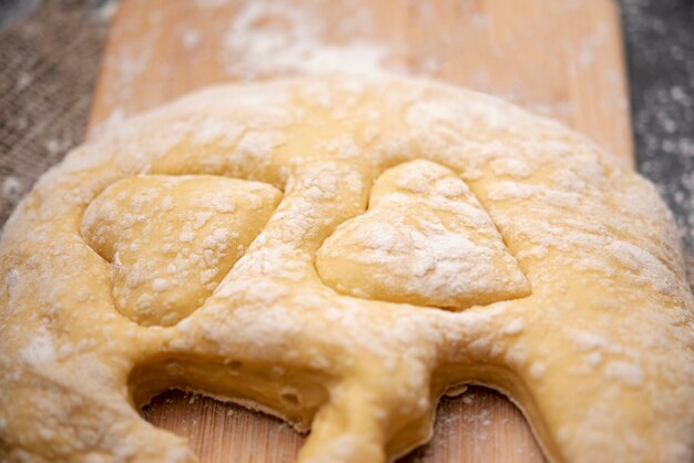 Free Photo close-up of dough with heart shapes