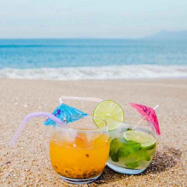 Close-up of drinks served on beach