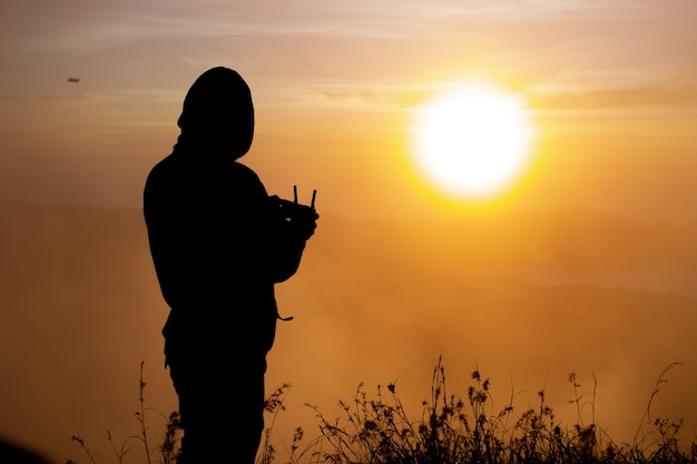 Close-up. drone pilot at dawn on the volcano Batur. Bali Indonesia