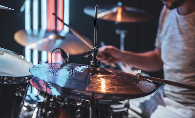 Close-up of a drum cymbal as the drummer plays.