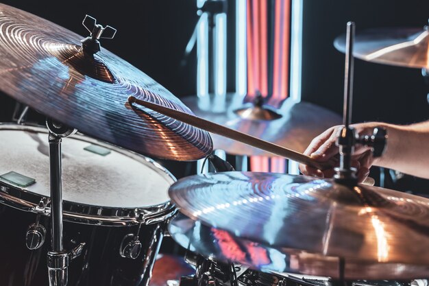 Close-up of drum cymbals as the drummer plays with beautiful lighting