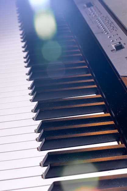 Free Photo close-up of an electronic piano keyboard in beautiful lighting.