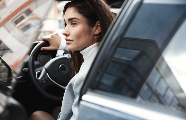 Free Photo close-up of elegant business woman getting in car to work