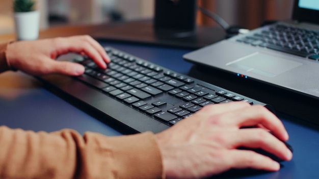 Free Photo close up of engineer hands typing on keyboard in home office.