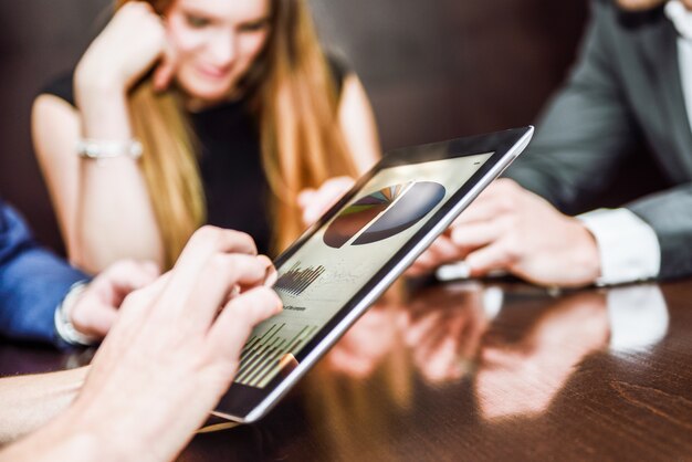 Close-up of executive working with a tablet