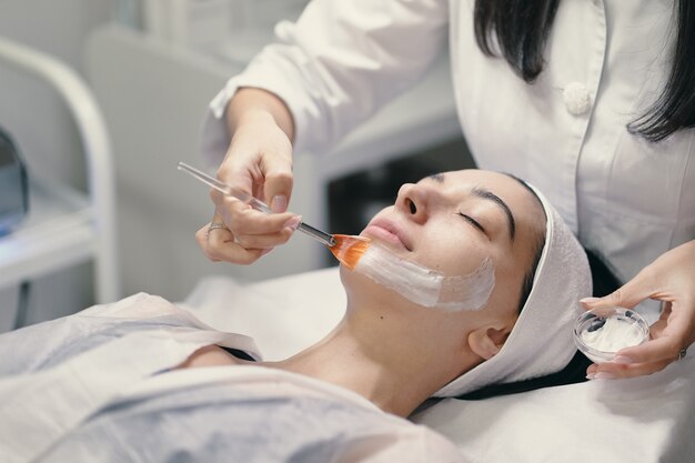 Close-up of the face of a young woman relaxing under the gentle