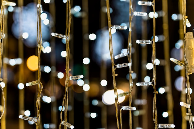 Free Photo close-up of fairy light against bokeh background