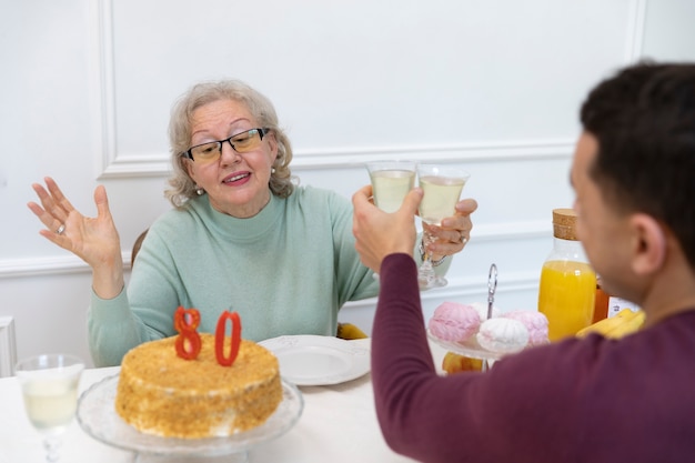 Free Photo close up family clinking glasses