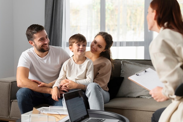 Free photo close up family discussing with therapist