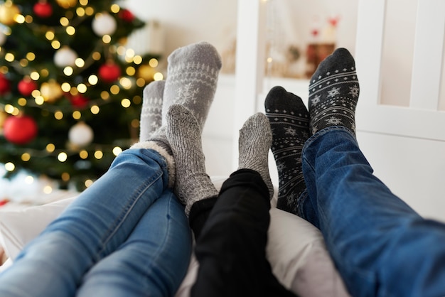 Free photo close up of family’s legs in warm socks