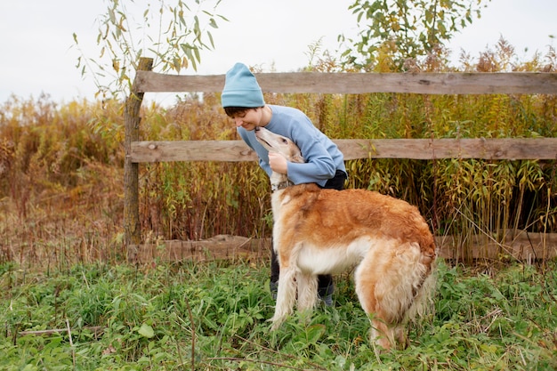 Close up on farmer spending time with dog