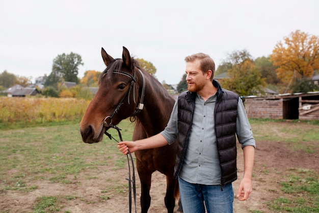 Close up on farmer with beautiful horse