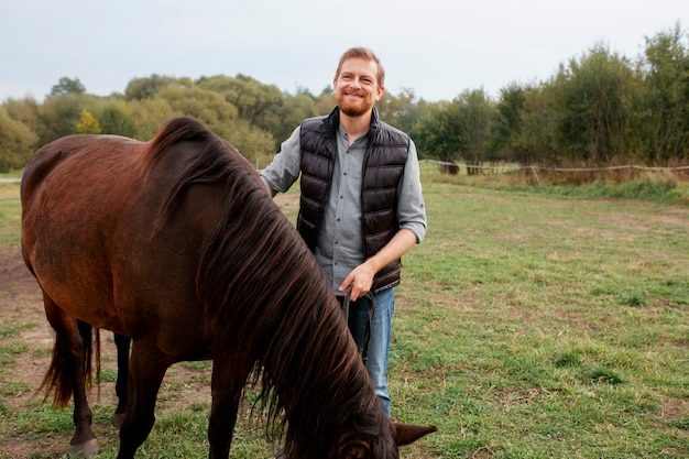 Close up on farmer with beautiful horse