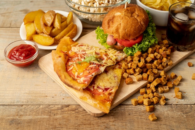 Close-up fast food and snacks on table