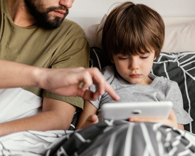 Free photo close-up father and son with tablet