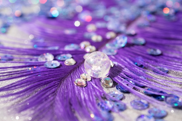 Free Photo close up on feather with confetti, sparks and glitter