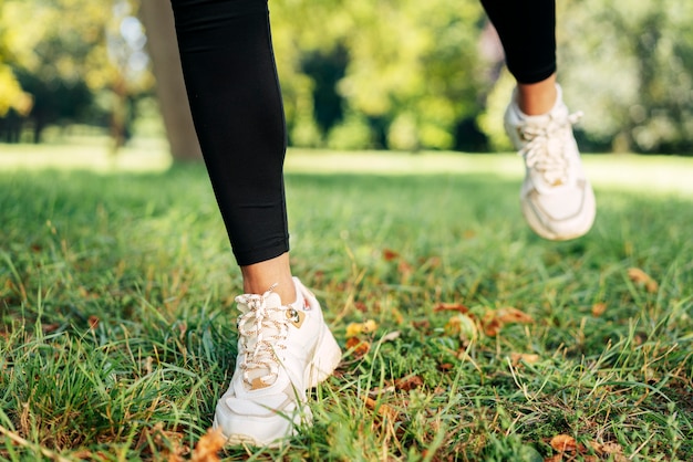 Close-up feet wearing shoes outdoors