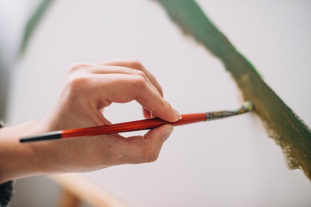 Close up of female artist painting