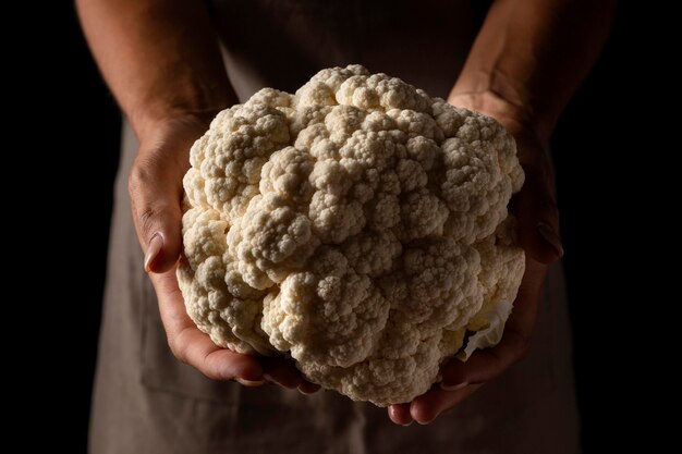 Close-up female holding cauliflower