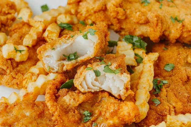 Close-up of fish and chips with herbs